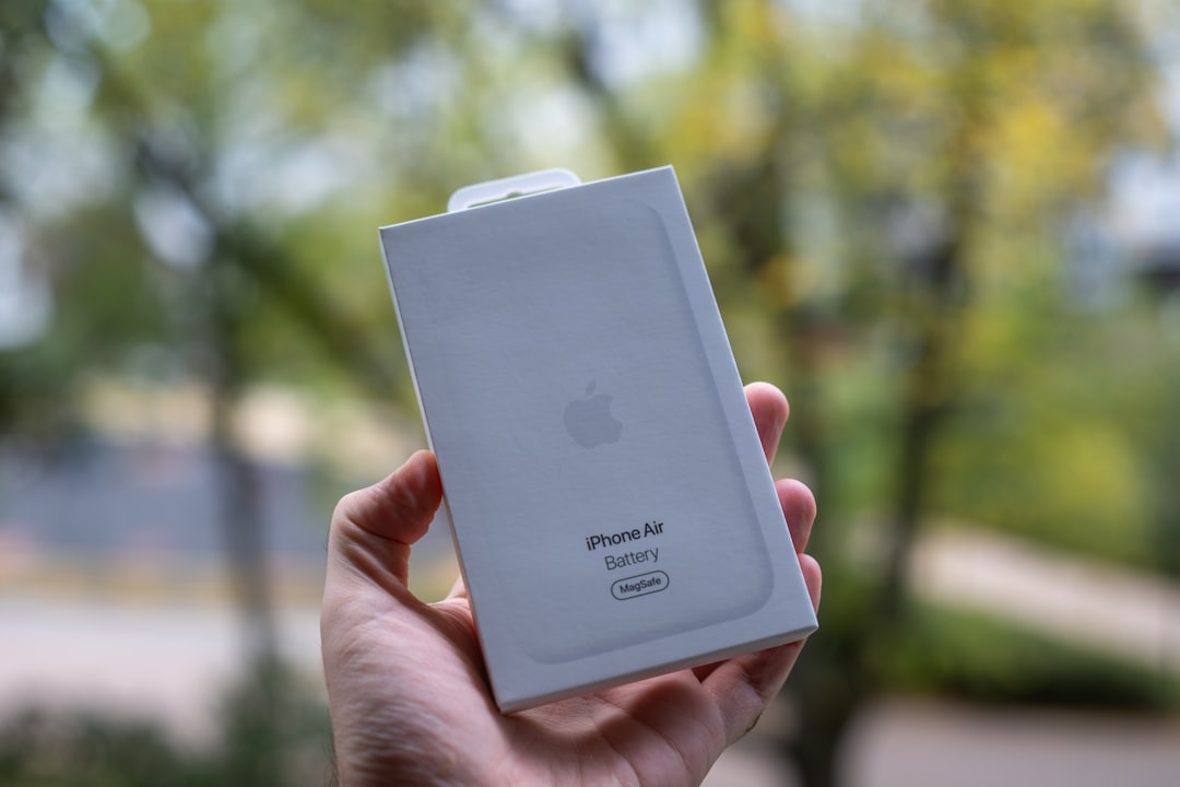 hand-holds-white-apple-iphone-se-box-outdoors-2zjnq1hl4na